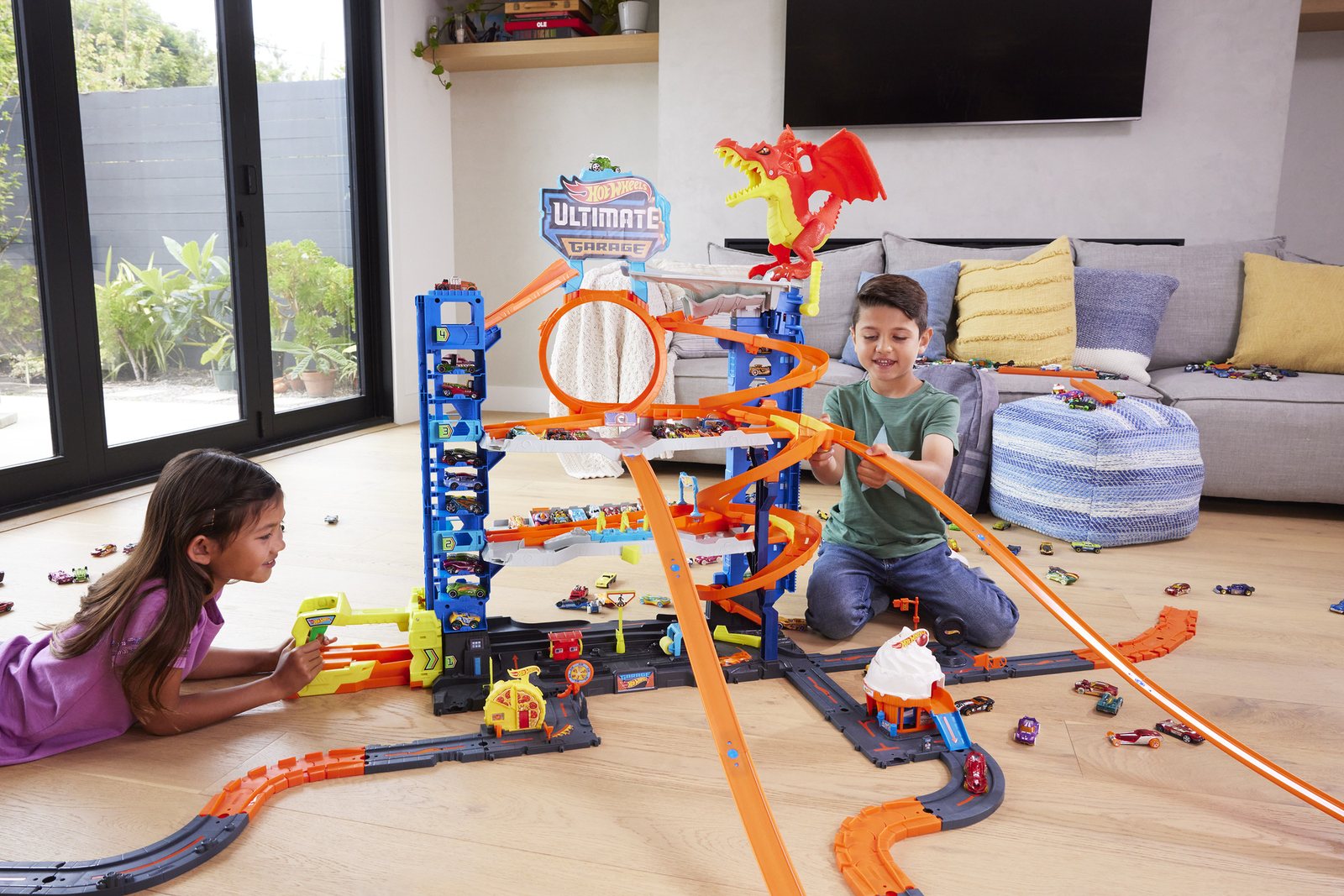 Kids racing Hot Wheels cars at the City Ultimate Garage